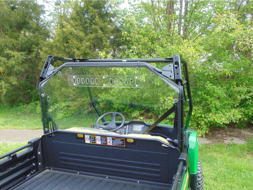 Rear view from behind the tailgate of the 3 Star Lexan back panel on the John Deere Gator XUV with vent slots