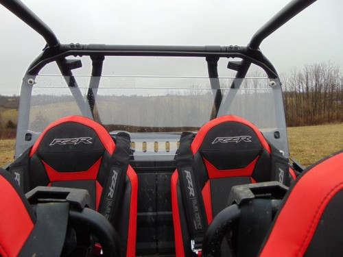 View from inside looking back at the 3 Star Lexan back panel with vents behind the red Polaris RZR XP 4 seats