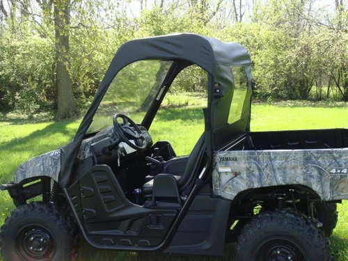 Side view of a camo Yamaha Rhino with the 3 Star soft top, vinyl windshield and rear window fitted