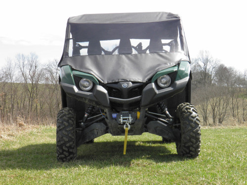 3 Star vinyl windshield, soft top and rear window on a green Yamaha Viking, black cab, front view on grass