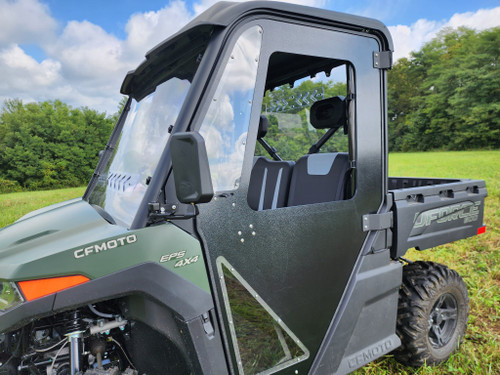 3 Star ABS hard door with clear window on a green CFMoto UForce 600, front three-quarter view in a field