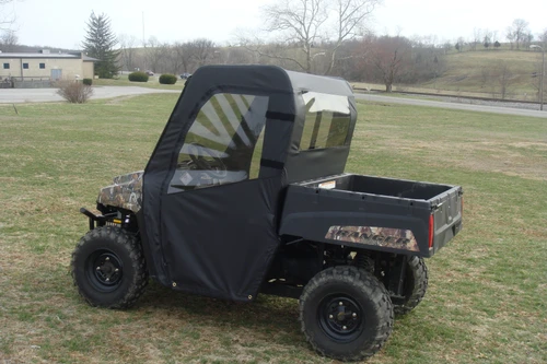 3 Star soft door and rear window combo on a camo Polaris mid-size Ranger 2-passenger, driver side view