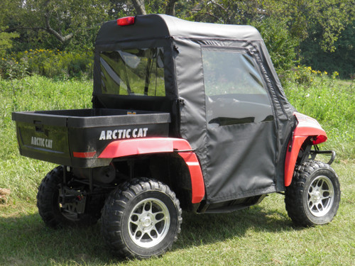 3 Star soft doors on a red Arctic Cat Prowler, rear three-quarter view on grass with the rear window
