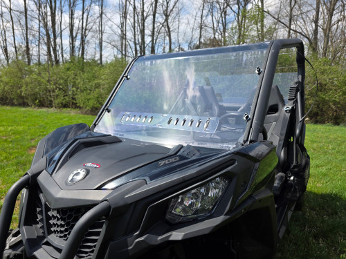 3 Star 1-piece front windshield with vents installed on a black Can-Am Commander, front corner view