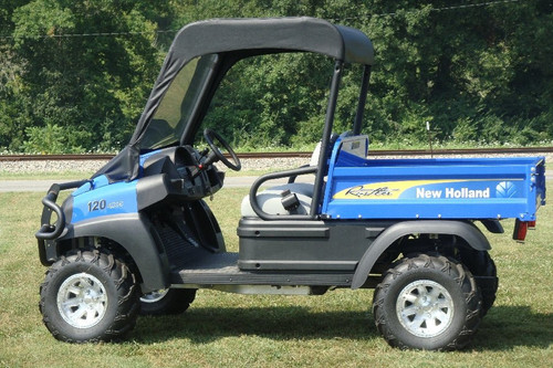 3 Star vinyl windshield and black top combo on a blue New Holland Rustler, driver side view on grass