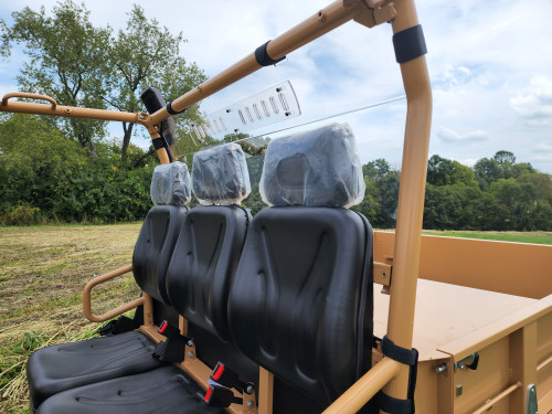3 Star Lexan back panel with vent slots mounted on the tan cage of a Tuatara behind the three-seat bench