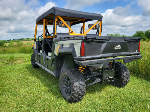 3 Star soft top for a hard windshield on a green crew side-by-side with orange cage, rear three-quarter view