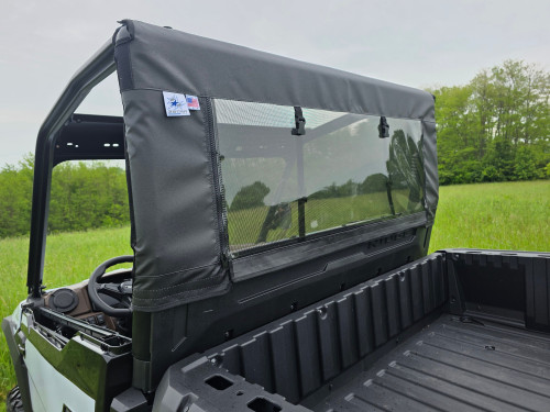 3 Star soft back panel with mesh window installed behind the cab of a Kawasaki Ridge, rear view over the bed