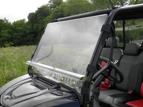 3 Star 2-piece windshield on an Intimidator Classic with red seats, driver side front view in a field