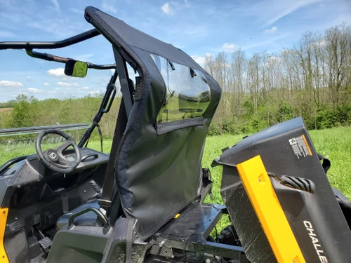3 Star soft back panel behind the seats of a Cub Cadet Challenger 400, angled view with bed tilted up