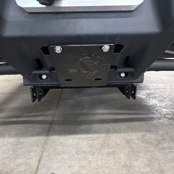 Denali MA11744 plow mount plate installed under the front bumper of a Can-Am Defender HD11
