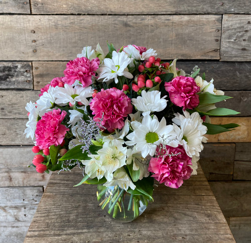 Pink Posies: a pink-centric arrangement of alstroemeria lilies, carnations, roses, and greenery in a vase. Pink Posies: a pink-centric arrangement of alstroemeria lilies, carnations, roses, and greenery in a vase.
