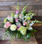 Sweet Tenderness: low and lush pastels with greenery in a vase.