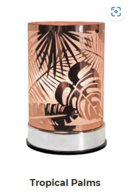 Tropical Palms Warmer casts a shimmery glow through a chic, copper metal tropical palm leaf design. A gorgeous addition to any decor!

Features:

- Replacement halogen bulb!
- Made of durable metal.
- Glass cup to safely hold your fragrance.
- Size: 4 in diameter x 6.5 in height

Scentchips® Touch Warmers feature a quick-warming bulb while adjustable settings allow you to control the amount of fragrance for your space! Eliminates flame, providing a safe heat source to melt your Scentchips® while creating a soft glow and tranquil ambiance.

Just plug in, select your desired brightness by touching the base, and enjoy your fabulous Scentchips® fragrance within minutes!