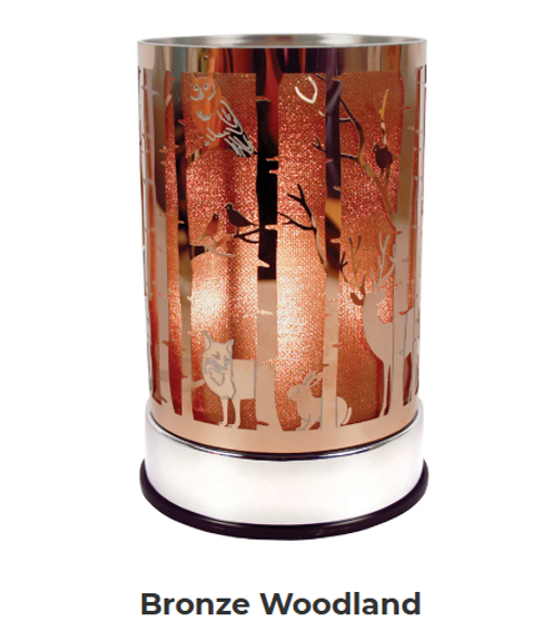 Bronze Woodland Warmer casts a shimmery amber glow through a nature-inspired, shimmery wildlife emboss. Super trendy!

Features:

- Replacement halogen bulb!
- Made of durable metal.
- Glass cup to safely hold your fragrance.
- Size: 4 in diameter x 6.5 in height

Scentchips® Touch Warmers feature a quick-warming bulb while adjustable settings allow you to control the amount of fragrance for your space! Eliminates flame, providing a safe heat source to melt your Scentchips® while creating a soft glow and tranquil ambiance.

Just plug in, select your desired brightness by touching the base, and enjoy your fabulous Scentchips® fragrance within minutes!