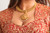 Gold earrings with pink center stone