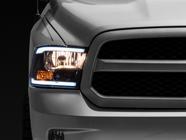 Raxiom 09-18 Dodge RAM 1500/2500/3500 Axial Series Headlights w/ LED Bar- Blk Housing (Clear Lens) - R131481