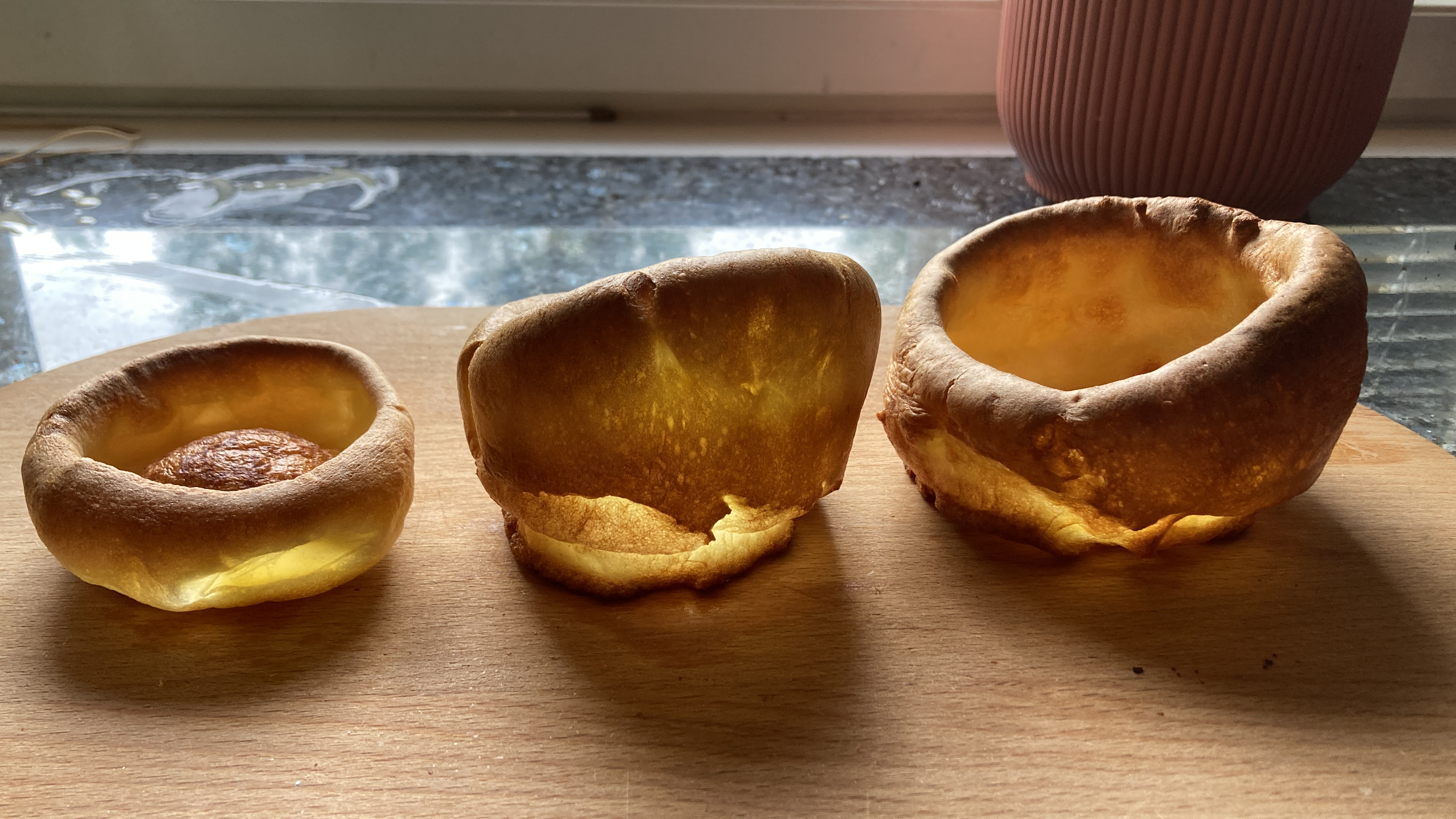 Side-by-side comparison of a shallow Wrenbury Yorkshire pudding tin and a deep muffin-style cup