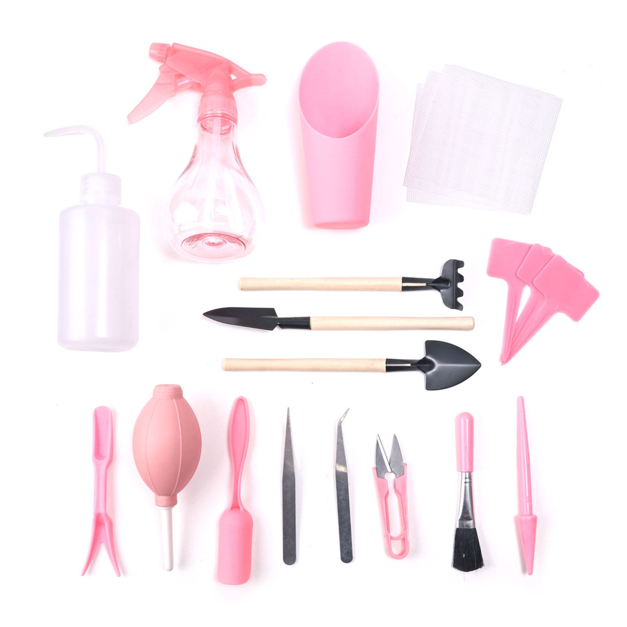 Pink gardening tools on white backgorund.