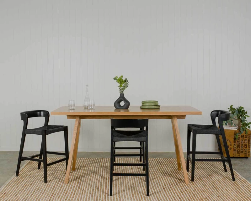 Black Grace stools paried with a natural oak bar leaner.