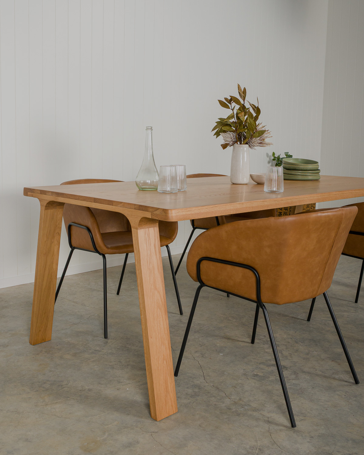 Henry tan upholstered dining chair paired with Harrison oak dining table in natural timber