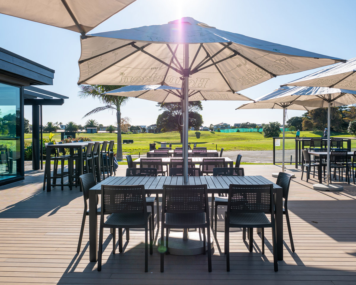 Outdoor hospitality seating overlooking the golf course at Mount Golf Club's renovated clubhouse.