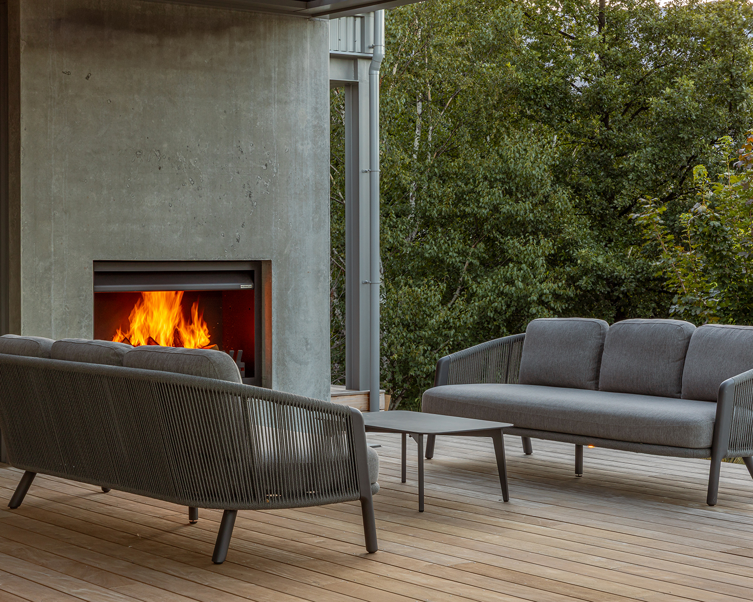 Outdoor sofas and a fire