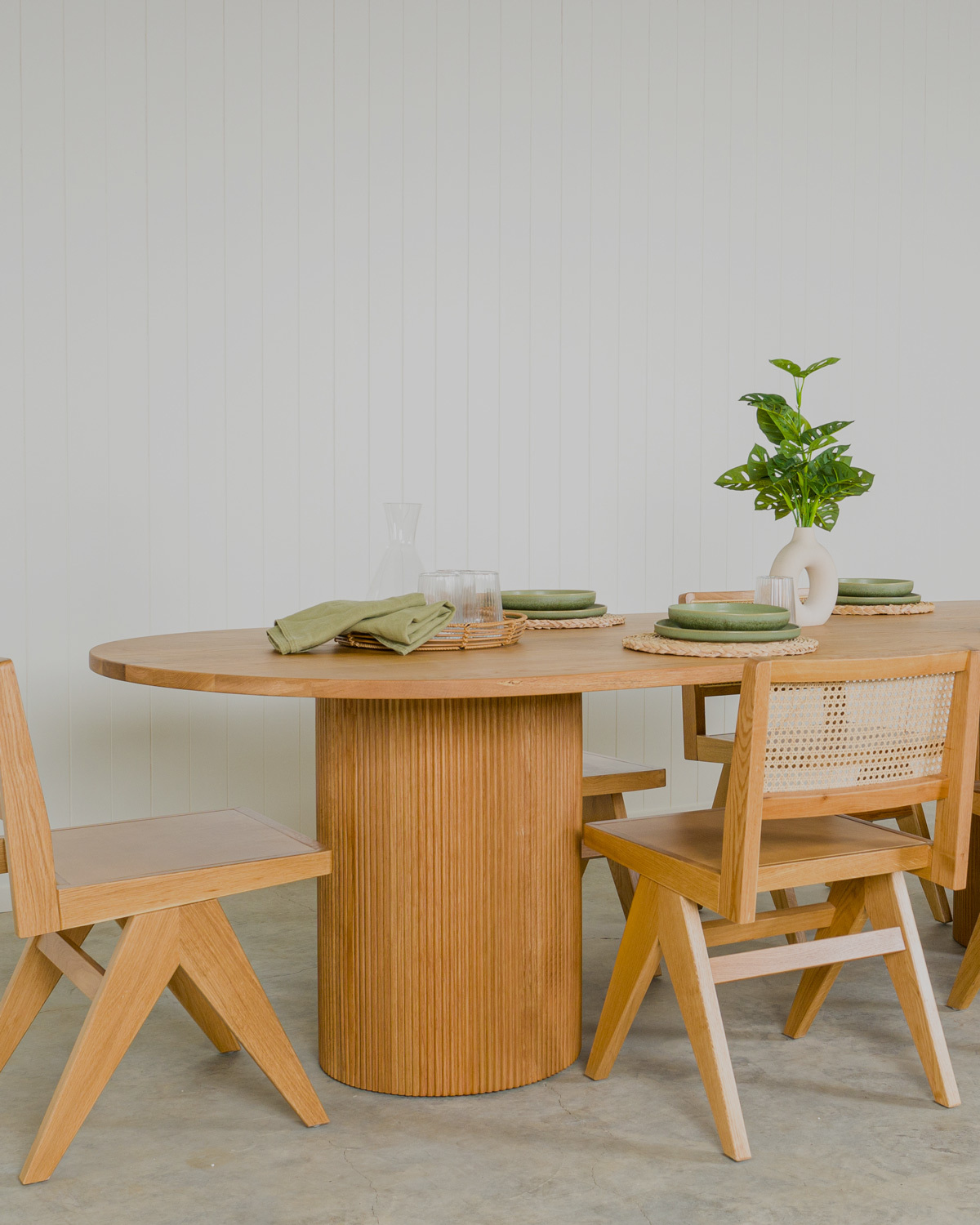 Reid solid oak oval dining table paired with Lillian dining chairs