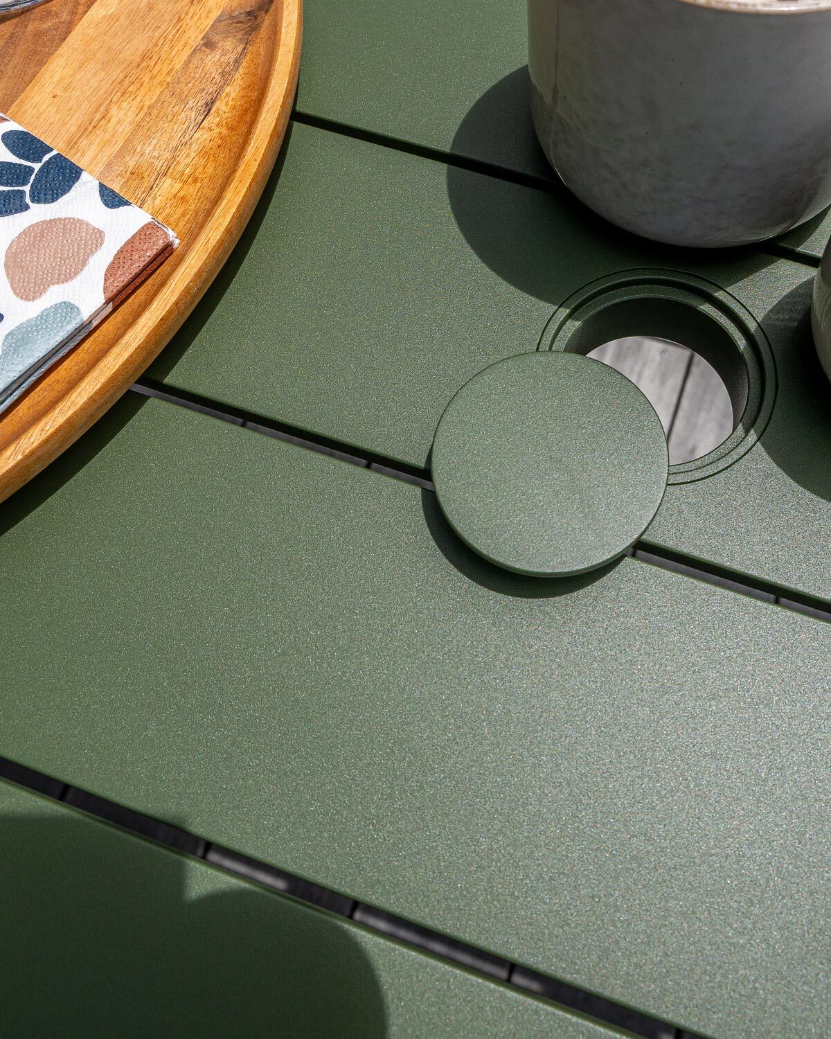 Slatted outdoor table powder coated in forest green