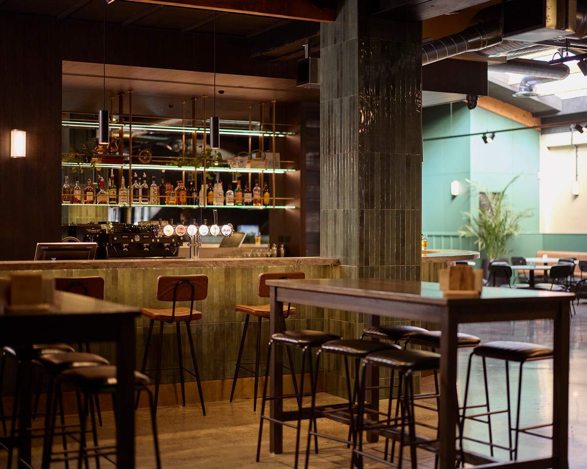 Walter and Bruce bar stools creating varied commercial seating around the bar at The 19th