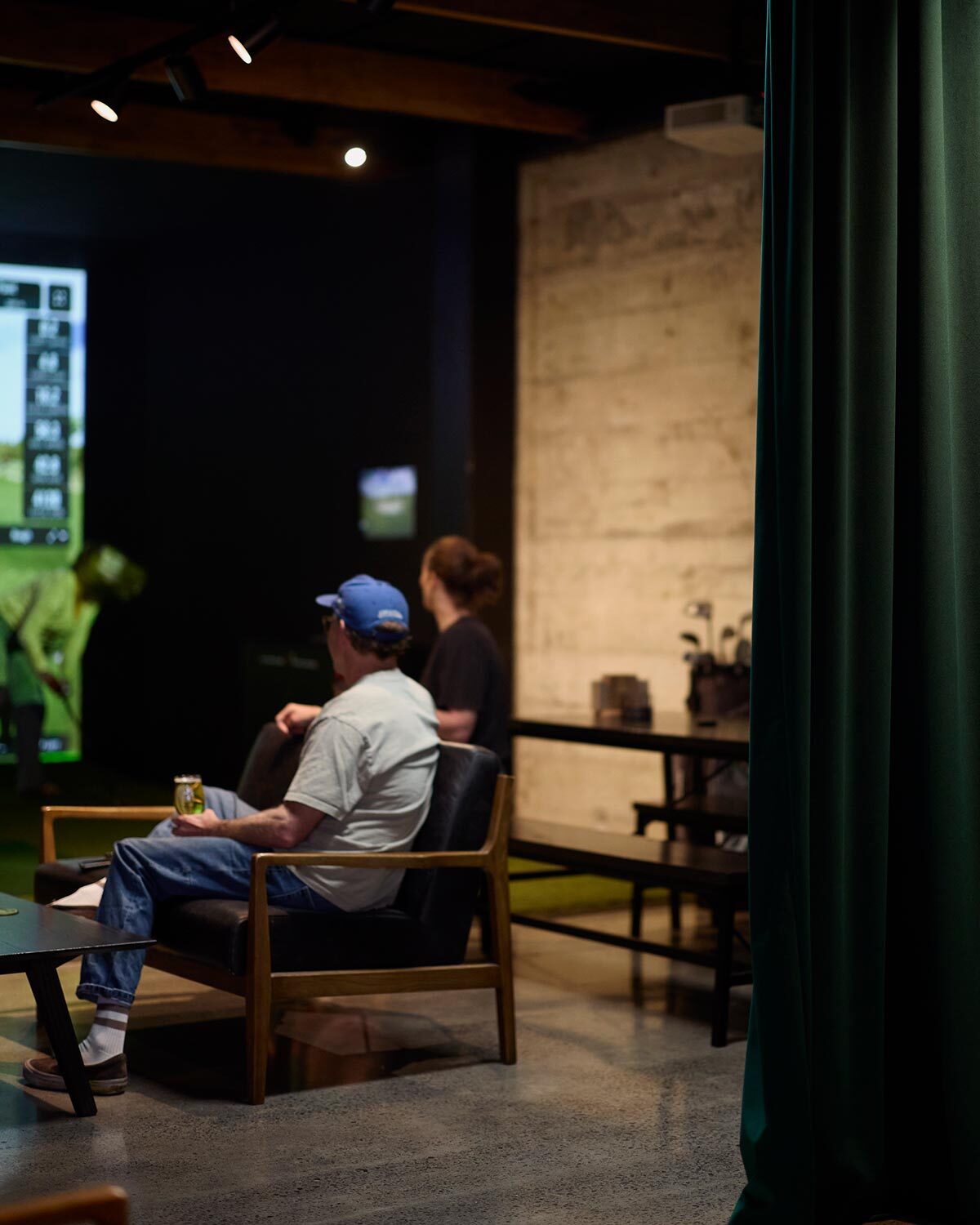 Alexander leather armchair providing relaxed seating in the golf simulator area at The 19th