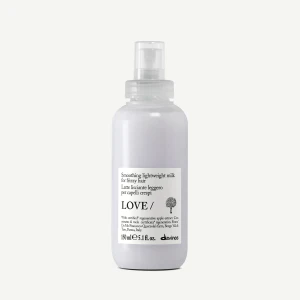 Davines - ESSENTIAL HAIRCARE -LOVE SMOOTHING Lightweight Milk  for fine to medium frizzy hair. This leave-on milk delivers a silky finish while enhancing natural shine, offering long-lasting frizz control without weighing hair down