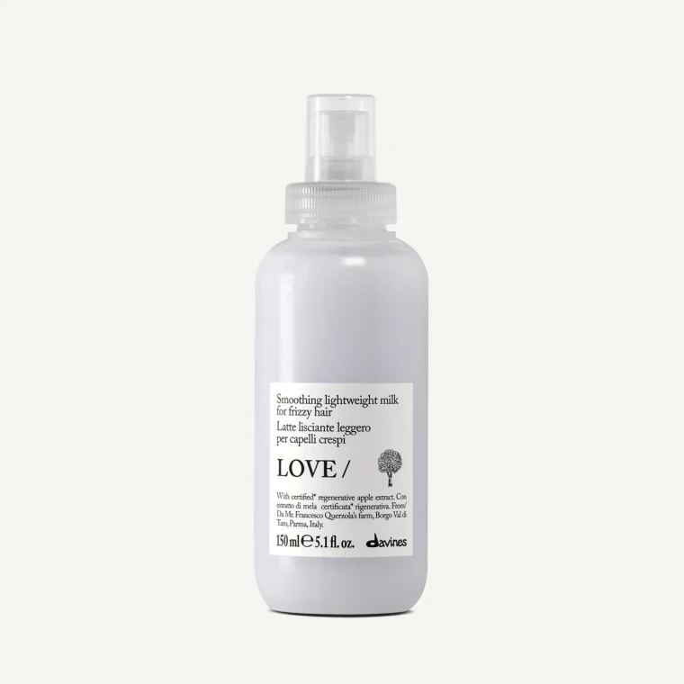 Davines - ESSENTIAL HAIRCARE -LOVE SMOOTHING Lightweight Milk  for fine to medium frizzy hair. This leave-on milk delivers a silky finish while enhancing natural shine, offering long-lasting frizz control without weighing hair down