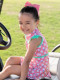 Ruffled Butts Tee Time Ruffled Girls Golf Dress Girl on golf cart