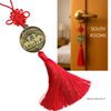 pi yao charm hung on room door 