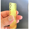 Hand holding Pixiu Gold Talisman Card showing its slim profile 