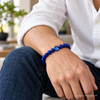 man wearing the blue medicine bracelet