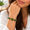woman wearing the green tara hum bracelet