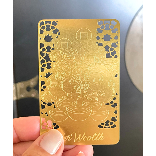 Pixiu Gold Talisman Card close-up showing detailed metal design