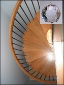 Cure for Spiral Stairways- hang a Crystal at the top.