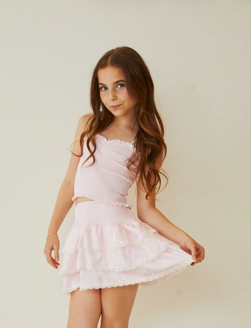 Theme Georgia Pink White Gingham Smocked Top. Its smocked detailing adds a flattering, tailored silhouette that pairs effortlessly with jeans or skirts for versatile styling. Coastal prep meets soft feminine