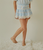 Theme Luna Pastel Blue Heart & White Lace Mini Skirt Tween Lightweight satin with a soft sheen, Smocked waistband = comfy, flexible, easy pull-on, Tiered ruffle mini with white lace trim, Pastel blue with subtle heart motif, Soft girl / coquette / dreamy spring, tween skirt, tween fashion