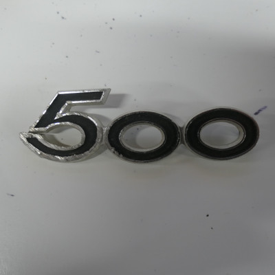 1969 SUZUKI T500 TITAN  USED SIDE PANEL EMBLEM BADGE 500CC TWO STROKE TWIN