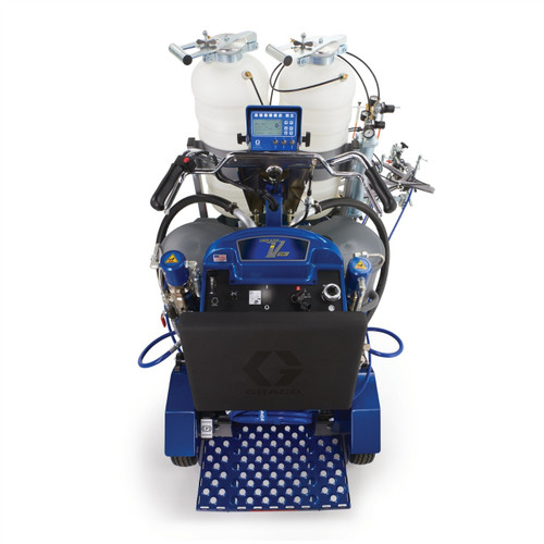 Overhead operator view of a blue Graco 17H473 LineLazer V 250DC HP Reflective dual-color striper, showing the handlebar steering, Remote Mount Control Box for skip-line programming, and pressure gauges for the dual 120 lb bead tanks.