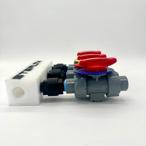 Side profile of the Stealth SP-012 Proportioner highlighting the 1/2" outlet and bypass ports on a durable UHMWPE manifold designed for low-flow 12V soft wash rigs.