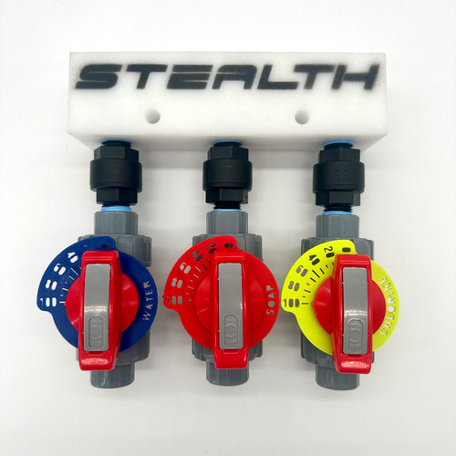 Front view of a Stealth 1/2" Soft Wash Proportioner (SP-012) featuring three 1/2" metering valves with precision dials and a manifold for accurate chemical mixing in 0-4 GPM systems.