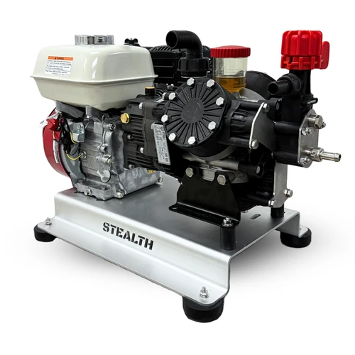 Three-quarter pump-side view of the Stealth AR45-SW soft wash system, showing the red pressure regulator, oil sight glass, black gear drive, Honda GX200 engine, and aluminum skid frame