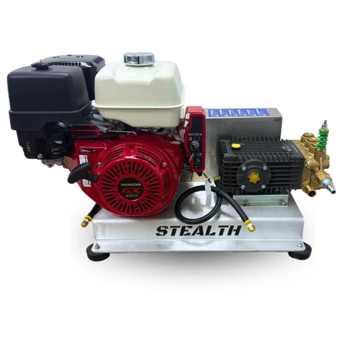 Profile view of the Stealth Operator Series 8 GPM 2500 PSI pressure washer skid, showing the red Honda GX390 engine, electric start switch, belt drive housing, and brass General Pump TSF2021 manifold.