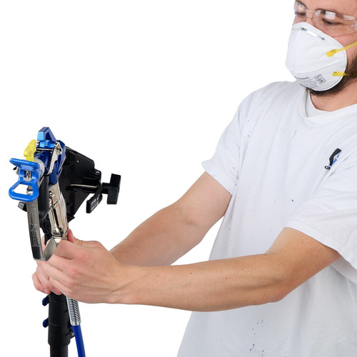 Close-up demonstration of a contractor attaching an airless spray gun to the Graco ProReach telescoping pole head