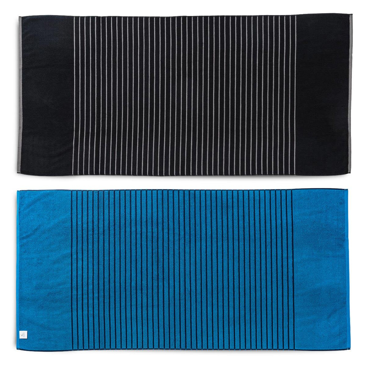 A reversible two-tone towel featuring black with stripes on one side and blue with stripes on the other side. It has a logo. A reversible two-tone towel featuring black with stripes on one side and blue with stripes on the other side. It has a logo.